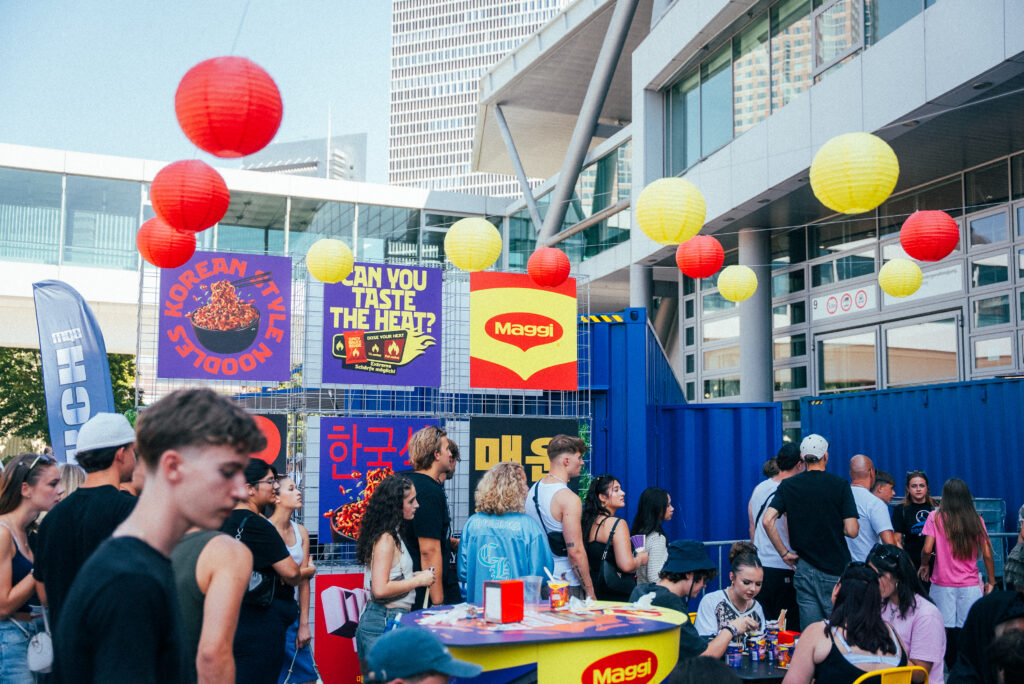 Neon lettering and Korean lanterns in the booth design for the MAGGI Brand Experience